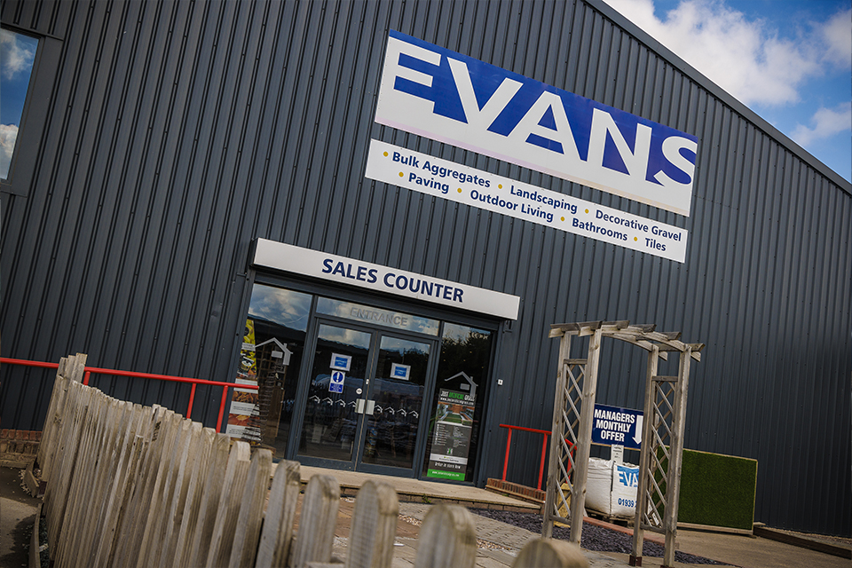 Evans aggregates sales counter building. grey steel building with double doors